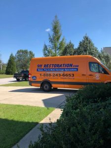 Water Damage Restoration Van At Residential Job Site